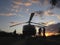 Film set and crew in Africa with helicopter low pass arial photography