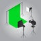 Film shooting object like as green curtain with studio light and video camera on