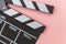 Filmmaker profession. Classic director empty film making clapperboard or movie slate isolated on pink background. Video production