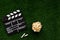Filmmaking concept. Movie Clapperboard. Cinema begins with movie clappers. Movie clapper on a background of green grass and