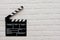 Filmmaking concept. Movie Clapperboard. Cinema begins with movie clappers. Movie clapperboard on a loft brick background