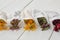 Filter tea bags filled with medicinal herbs - marjoram, heather, marigold flowers and rose petals. Alternative medicine