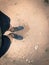 Filtered image top view man wearing sport shoes sneakers on muddy race track