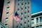 Filtered image waving American flag on federal buildings in downtown Chicago