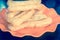Filtered image youtiao or Asian doughnut in orange plate on wooden table close-up