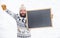 Final sales. ski and sledge. happy hipster with blackboard. bearded man in warm clothes. Happy new year. winter holiday