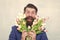 Finally spring. Making surprise. Gentleman with tulips. Spring is coming. Greetings. Bearded man tulip bouquet. Womens