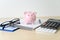 Finance Accounting Calculation calculator  piggy bank and taxes