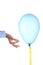 Finance burst concept: caucasian man`s hand holding a nail burst a party balloon isolated with clipping path