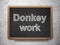 Finance concept: Donkey Work on chalkboard background