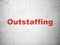 Finance concept: Outstaffing on wall background