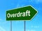 Finance concept: Overdraft on road sign background