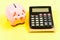 Finance department. Credit debt concept. Economics and finance. Piggy bank pink pig and calculator. Business