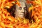 finance image of burning dollar bill and fire flames
