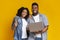 Financial Compensation Online. Black Couple Posing With Laptop And Credit Card