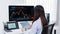 Financial concept a businesswoman studying the stock chart to decide to invest in which stock fund