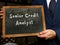 Financial concept meaning Senior Credit Analyst with inscription on the black chalkboard
