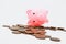 Financial crisis symbol. Economic impact global recession. Dead Piggy bank and coins on white background