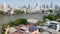 Financial district near calm river. View of skyscrapers located on shore of tranquil Chao Praya river in downtown district of