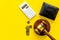 Financial failure, bankruptcy concept. Judge gavel, wallet, coins, calculator on yellow background top view copy space