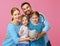 Financial planning happy family mother father and children with piggy Bank on pink