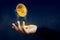 Financial or Profit as Easy Concept, Golden Money Coin float over Magician hand like a Magic, Dark light