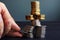 Financial Stability. Man holding coin in the coins stack.