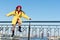 Find balance. Childhood is about happy memories. Smiling little kid in hat sky background. Small girl wear fall outfit