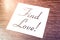 Find Love Reminder On Paper Lying On Wooden Cupboard