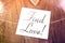 Find Love Reminder On Paper Lying On Wooden Table