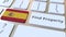 Find Property text and flag of Spain on the keyboard. Online real estate service related conceptual 3D rendering