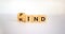 Find your kind symbol. Turned cubes with words find kind. Beautiful white table, white background, copy space. Business,