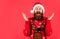 Finding perfect present. Bearded man santa hat. Emotional hipster winter knitted sweater red background. Winter holiday