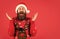 Finding perfect present. Bearded man santa hat. Emotional hipster winter knitted sweater red background. Winter holiday