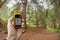 Finding the right position in the forest via gps ( blurred background)