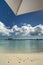 Finding shade under umbrella at the beach, Nassau, Bahamas