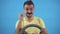 Finding a solution male freak with mustache driving a car on a blue background isolate