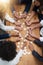 Finding solutions piece by piece. High angle shot of a group of businesspeople building a puzzle together in an office.