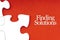 FINDING SOLUTIONS text with jigsaw puzzle on red background