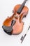 fine acoustic violin and bow on a white background