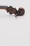 fine acoustic violin scroll with pegs on a white background