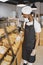 Fine African American man in mask offering pastry