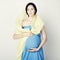 Fine art portrait of young pregnant woman