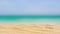 Fine beach sand in summer sun sea motion blur background.