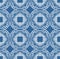 Fine blue geometric lace patterns on blue background.