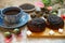 A fine breakfast, a mug of tea, fresh rolls with poppy seeds and poppy flowers