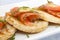 Fine dinning, small potato pancakes with salmon slices and dill