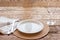 Fine empty tableware on wooden background