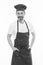 He is a fine hand at cooking. Senior cook with beard and moustache wearing bib apron. Mature chief cook in red cooking