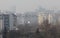 Fine particulate matter air in the city and PM2.5 dust. Cityscape of buildings with bad weather from Fine Particulate Matter. Air